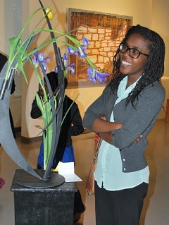 A Millikan employees enjoys a piece of art inside the workplace